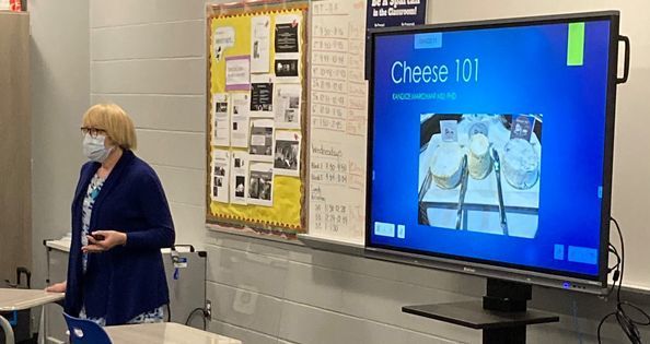 Ms. Davey teaching class about cheese