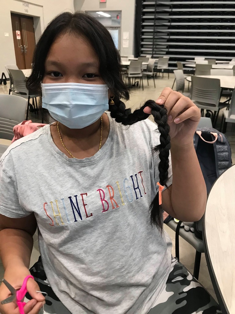 Student posing with the hair braid she made