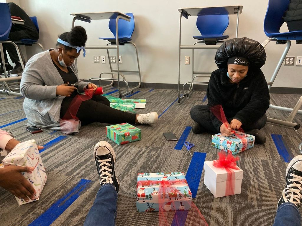 Students wrapping gifts