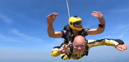 Mr. Patty skydiving from a plane
